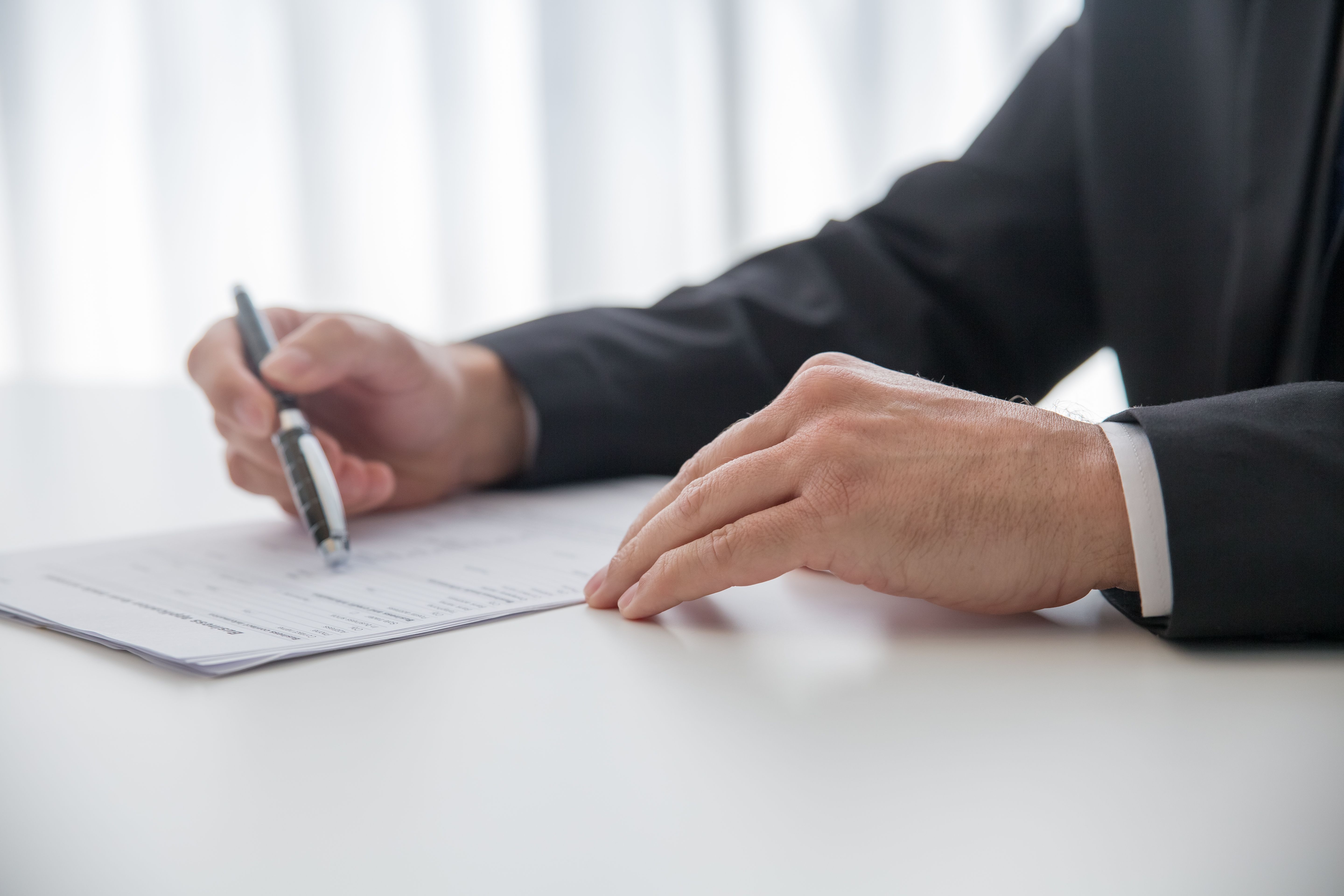 Foreign buyer signing a preliminary contract for a new-build in Georgia, 2026